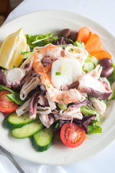 fresh shrimp, scallop and calamari on greens with tomato, cucumber, and lemon